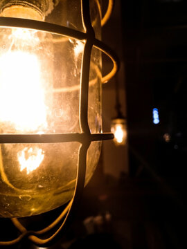 Selective focus on a lit glass bulb at a restaurant in Bengaluru, India.