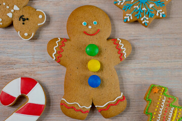 Gingerbread cookie, snowman, teddy bear, Christmas tree. Top view New Year and Christmas composition