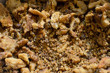 Homemade freshly crispy meaty greaves,  picked pork greaves close up. traditional winter food. delicious unhealthy fried pork greaves  top view full frame 