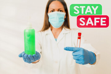 Conceptual hand writing showing Stay Safe. Concept meaning secure from threat of danger, harm or...
