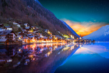 Hallstatt village at night in Austrian alps with stars in the sky