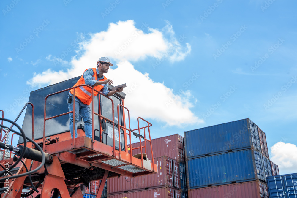 Poster container worker working and checking at container warehouse.