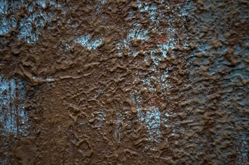 Still-life. Photo of the wall surface with streaks and clumps of plaster. In Dark Reds and bright...