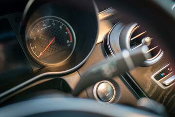 Tachometer in the interior of an elegant sports car.