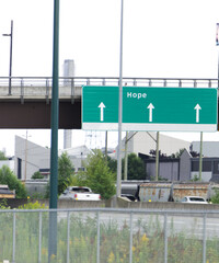 Fototapeta na wymiar sign to hope on highway