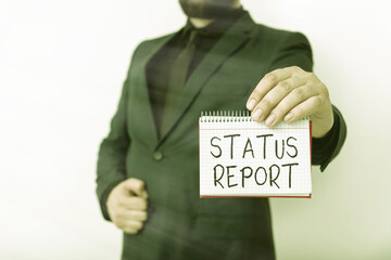 Text sign showing Status Report. Business photo text summarizes the particular situation as of a...