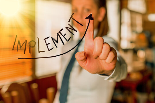 Text sign showing Implement. Business photo text to provide instruments or means of expression for something digital arrowhead curve rising upward denoting growth development concept