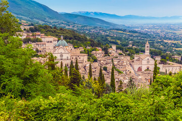 Fototapeta na wymiar A view from the Castle Rocca Maggiore over the hillside town of Assisi, Umbria in the summertime