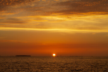 sun touching the horizon in key west