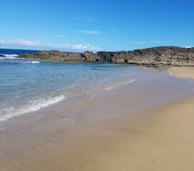 Fototapeta na wymiar sand and ocean water on beach in Isabela, Puerto Rico