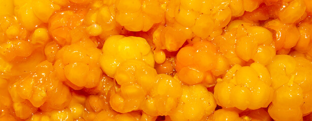 Forest berry cloudberry.Background cloudberry with sugar.