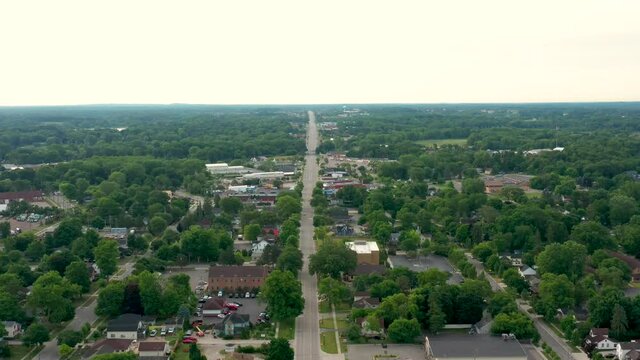 Scenic aerial flyover of a small town America on a quiet morning with empty streets 06