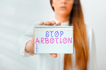 Writing note showing Stop Arbotion. Business concept for advocating against the practice of...
