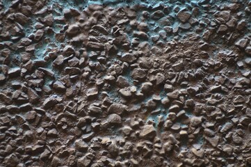 Still-life. Photo of the wall surface with streaks and clumps of plaster. In Dark Reds and bright Blues.