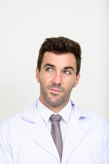 Face of handsome Hispanic man doctor thinking