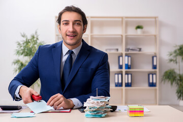 Young male financial manager in the office