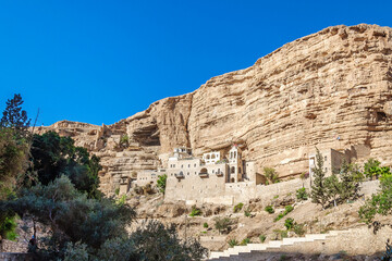 Fototapeta na wymiar Orthodox Monastery of St. George Hosevit (Mar Jaris) in the Wadi Kelt Gorge. Judean desert near Jericho. Palestine, Israel.