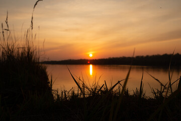 Beautiful sunset on the banks of a large river