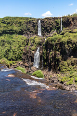 Forest, waterfalls and river with rocks