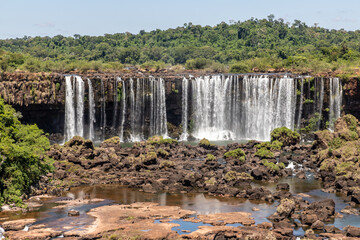 Forest, waterfalls and river with rocks
