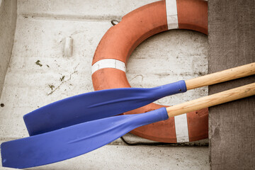 Still life: oars and lifebuoy in a boat