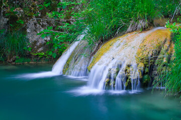 Natural waterfall and lake in Polilimnio area in Greece