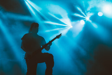 Guitarist silhouette. Silhouette of man with electric guitar.