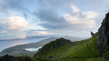 Rainbow by the Old Man of Storr. Hiking in the Quairing Mountains on the Isle of Skye in Scotland