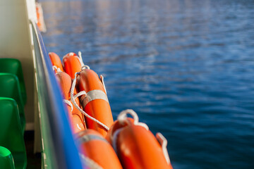 Board of the ferry sea voyage. Lifebuoys. Rescue help. Blue  background. Travel by water....