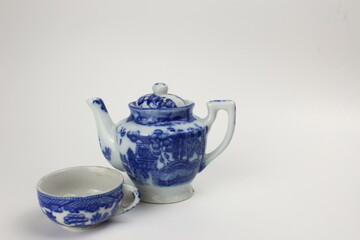 Antique teapot with teacup