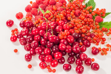 Assorted berry on a white background. Cherries, raspberries, red currants.