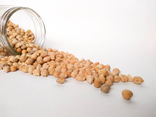 Chickpeas in glass fresaco on white background