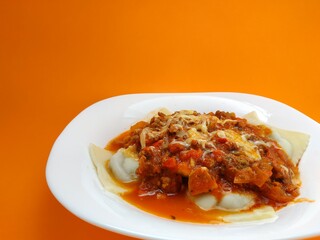 
Sunday ravioli with an orange background