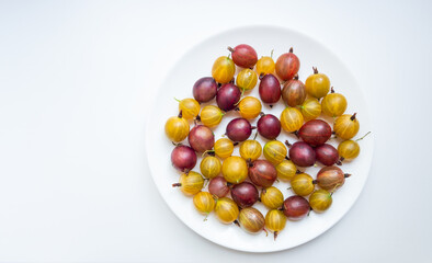 Gooseberries on a white plate