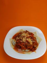 
Sunday ravioli with an orange background