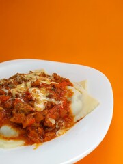 
Sunday ravioli with an orange background