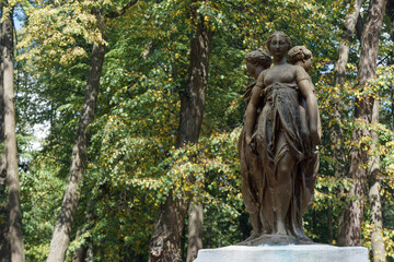 City Park. Ancient sculpture of three women - three graces. - obrazy, fototapety, plakaty