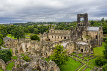 Fototapeta na wymiar Kirkstall Abbey in Leeds, Yorkshire England. Old ruined architecture of the abbey and grounds close to Leeds city centre in West Yorkshire. 