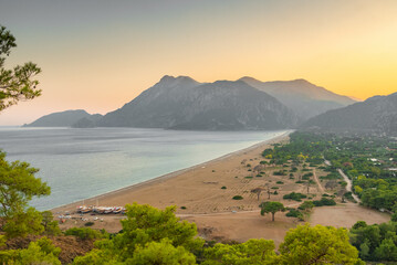 Obraz premium Beautiful sunset view of the Cirali Olympos beach at Mediterranean sea, Antalya, Turkey