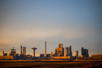 oil refinery at sunset