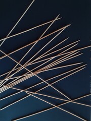 wooden sticks on blue background