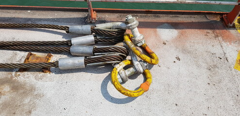 wire slings attached together with shackles and master link