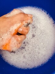 close up of a woman hand holding a bowl of salt