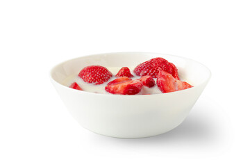 Many slices of strawberry sinking in white milk or cream laying in white porcelain bowl. Healthy and gourmet food concept. Isolated on white photo