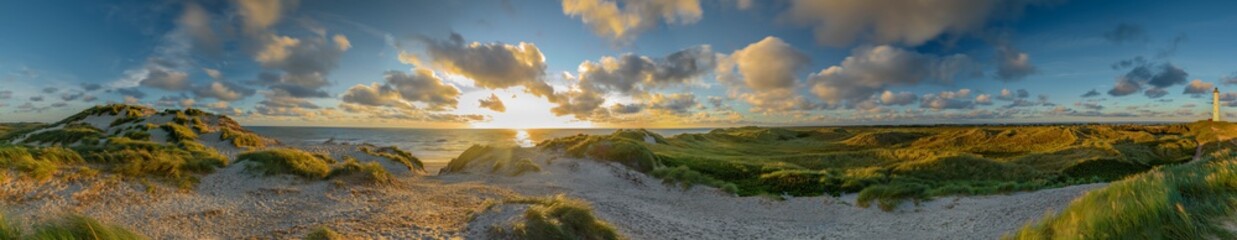 Panoramic view of Lyngvig lighthouse on wide dune of Holmsland Klit with beach view on the west...
