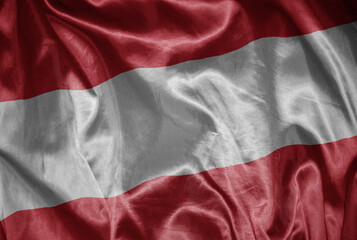 colorful shining big national flag of austria on a silky texture.