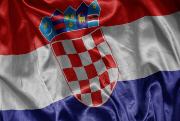 Obraz premium colorful shining big national flag of croatia on a silky texture.