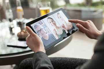 woman using a tablet computer for video chat