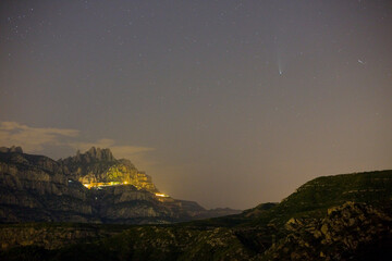 Obraz na płótnie Canvas Comet C2020 F3 Neowise and Montserrat mountain, Barcelona, Catalonia, Spain.