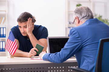 Young man visiting embassy for visa application
